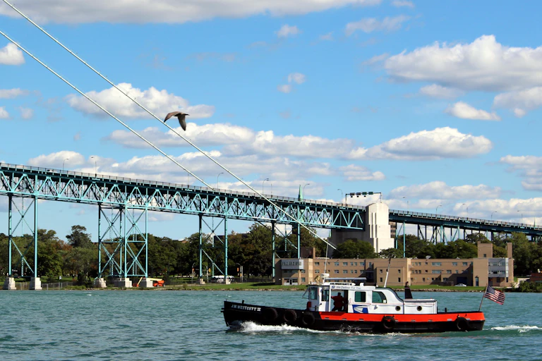 A boat on the Detroit River delivers mail to and from ships.