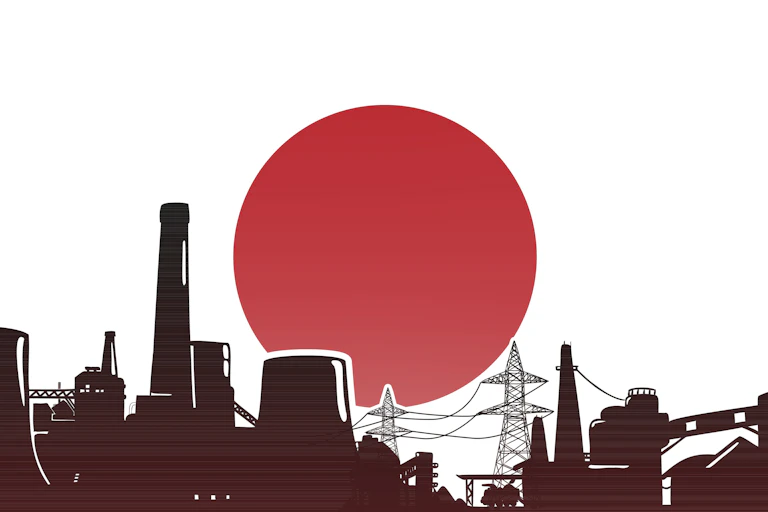An industrial skyline in front of the Japanese flag