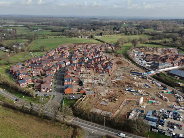 Aerial view of new housing development next to fields