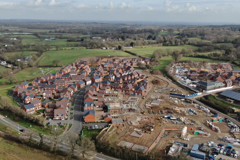 Aerial view of new housing development next to fields