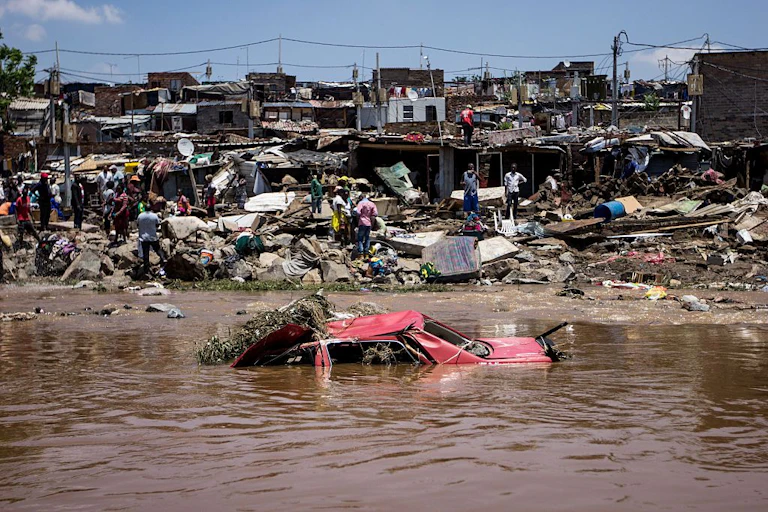 Car and homes flooded in Alexandra next to the Jukskei River