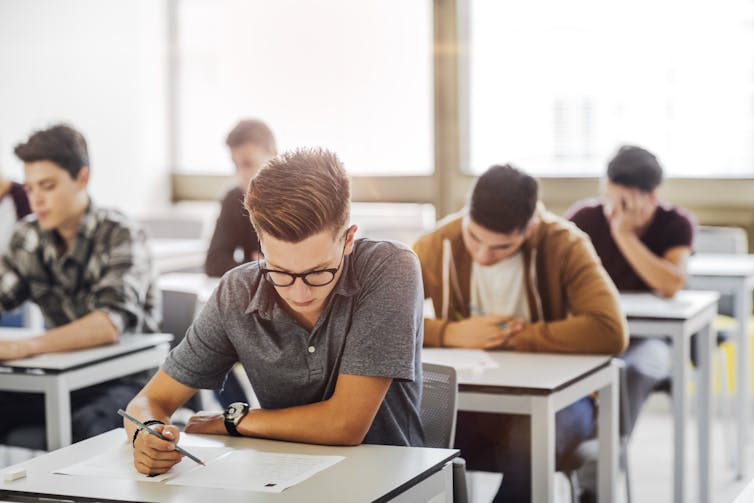 Students sitting an exam in classroom