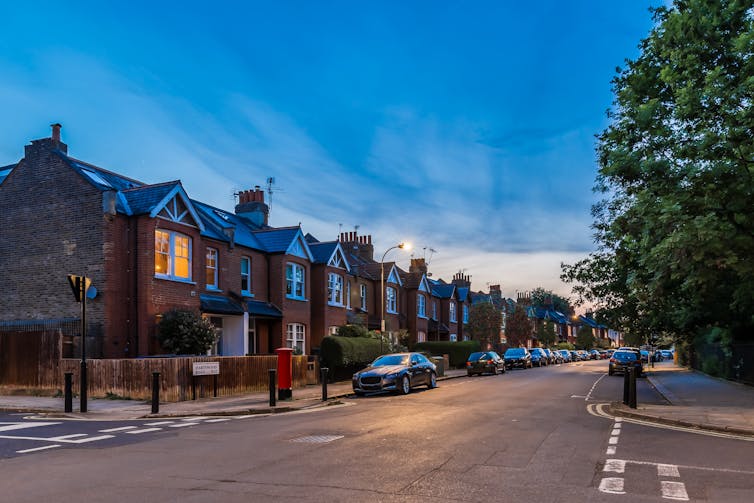 A London street at dusk.