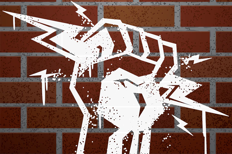 stencil of fist holding lightning bolts with brick background