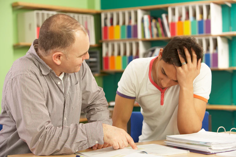 Tutor helping struggling university student