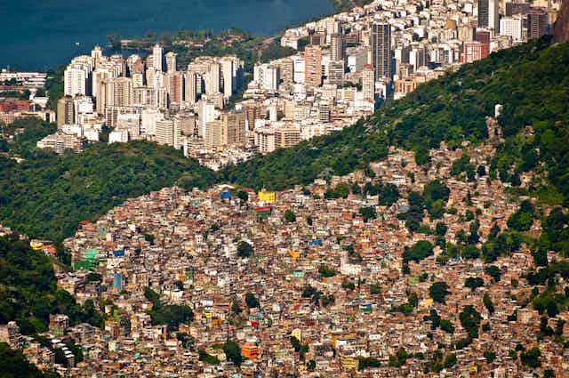 Rio de Janeiro favelas and skyscrapers separated by a forest