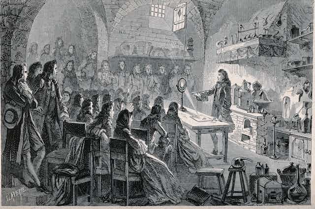Crowded lecture hall with Isaac Newton performing an experiment.