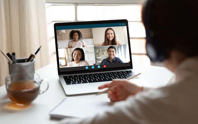 A screenshot of people on a videoconferencing.