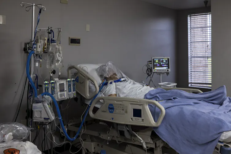 Man attached to ventilator.