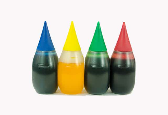 Close-up of bottles of food coloring