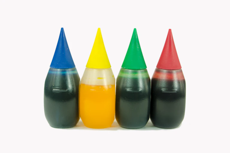 Close-up of bottles of food coloring