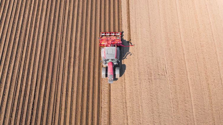 A tractor plowing a field.