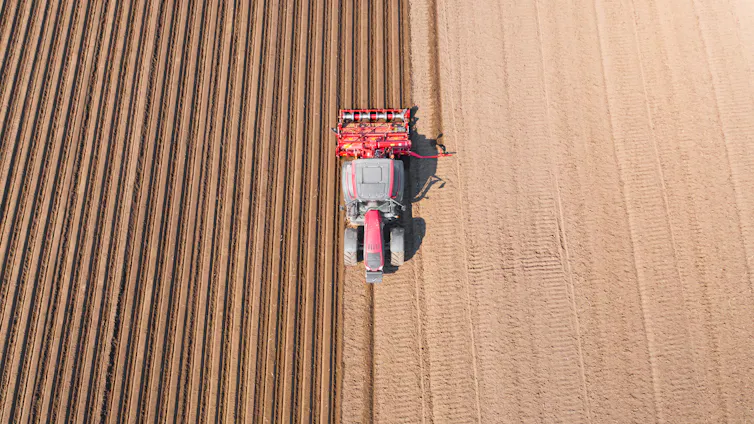 A tractor plowing a field.