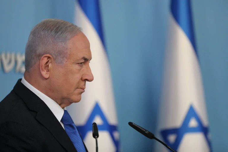 Benjamin Netanyhu with Israeli flags.