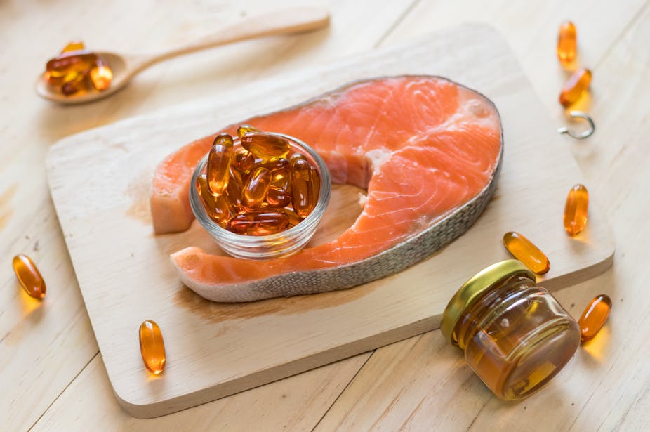 Salmon and omega-3 fish oil capsules.
