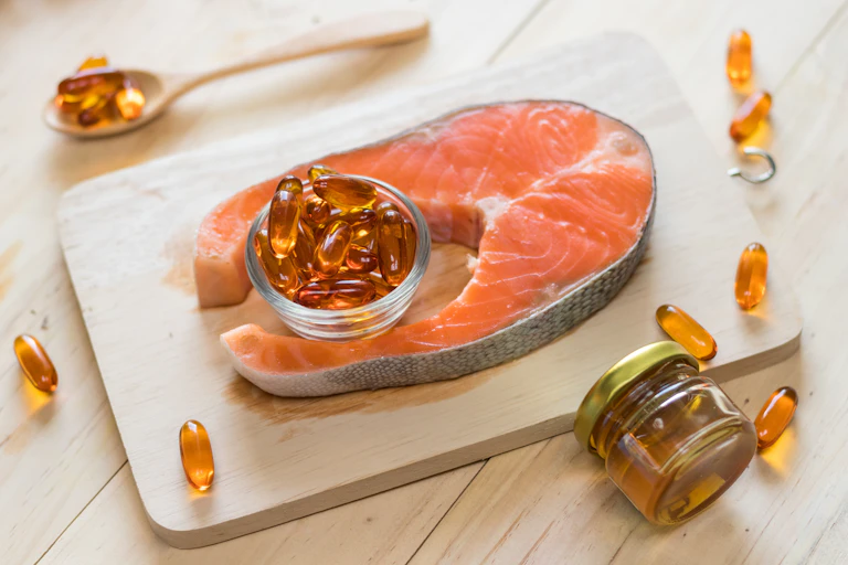 Salmon and omega-3 fish oil capsules.