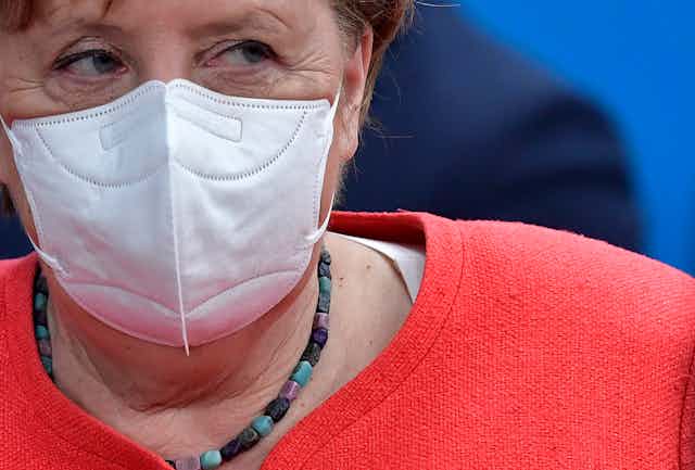 Angela Merkel wearing a mask. 