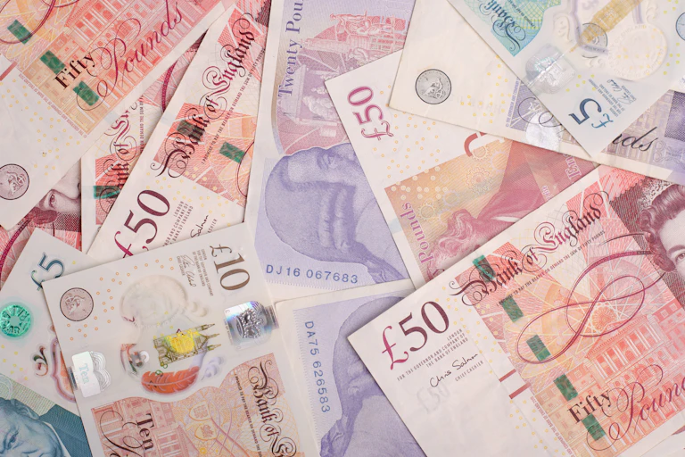 A pile of £10, £20 and £50 notes.