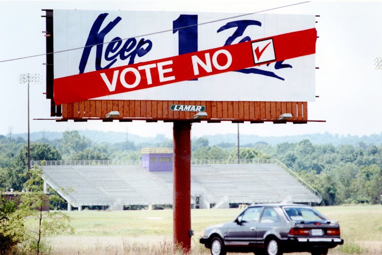 A banner that read 'Vote no' was added to billboards that read 'keep 1 team' near a Nissan plant in Smyrna, Tenn.