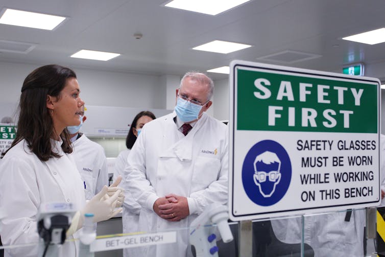 Scott Morrison talks with a scientist during a visit to AstraZeneca laboratories in Sydney.