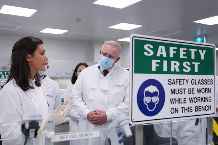Scott Morrison talks with a scientist during a visit to AstraZeneca laboratories in Sydney.