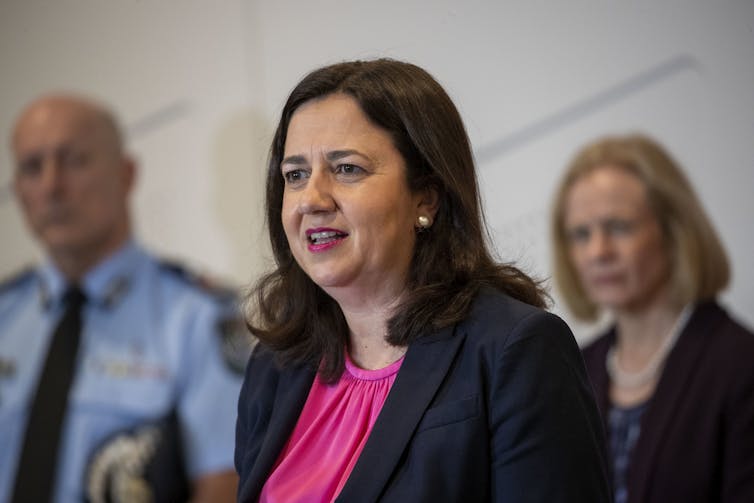 Queensland Premier Annastacia Palaszczuk in a pink top and black blazer