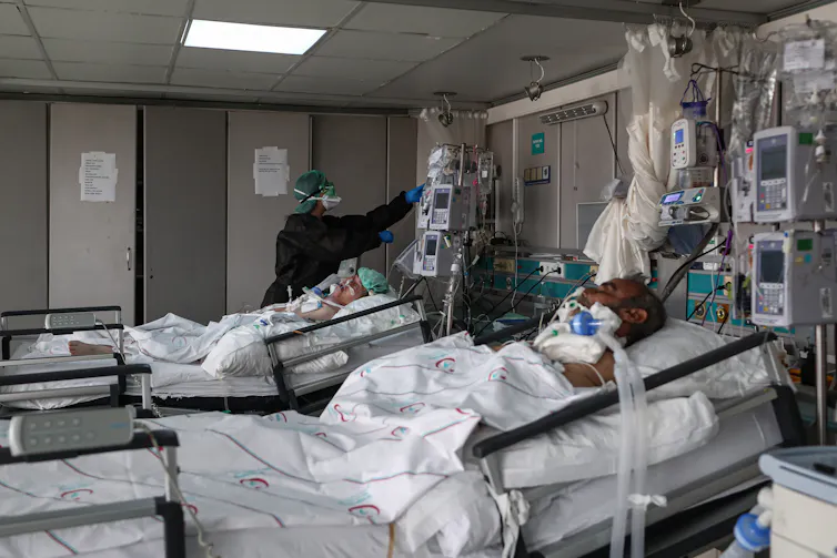 Two patients in an intensive care ward.