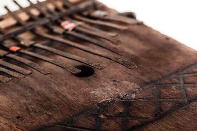 An old and rusty African mbira or thumb piano.