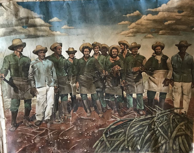A painting of Cuban sugar cane cutters.