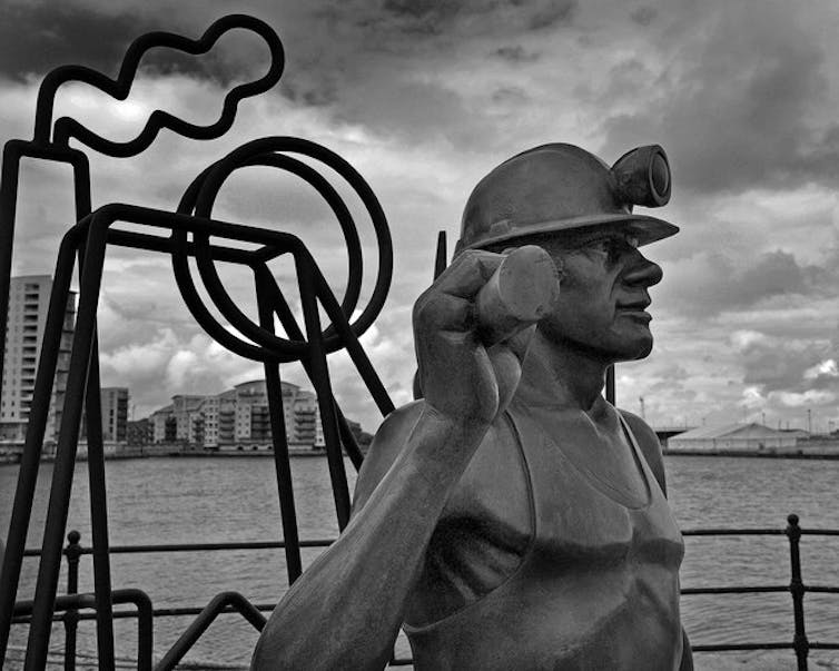 Black and white photograph of coal Miner sculpture in Cardiff Bay.