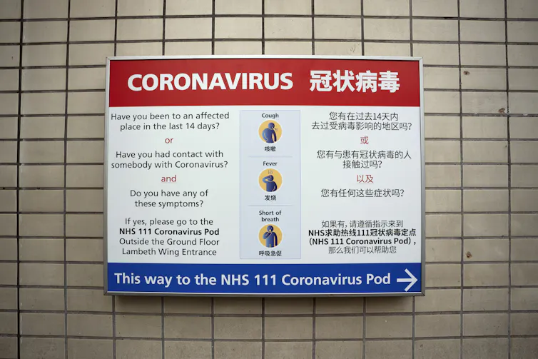 A public sign displaying coronavirus information in English and Chinese.