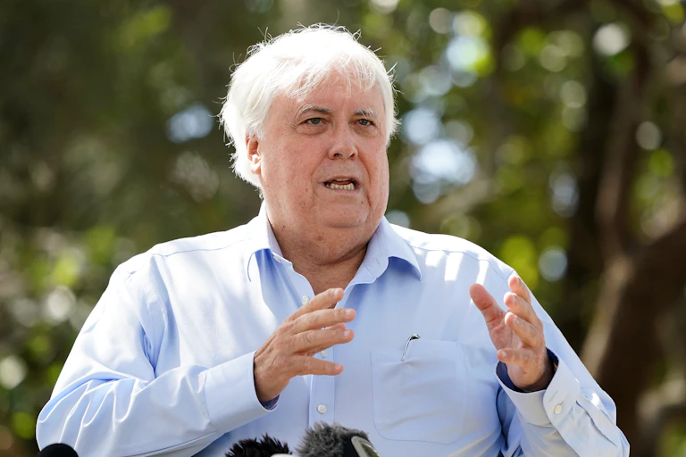 Businessman Clive Palmer talks to the media