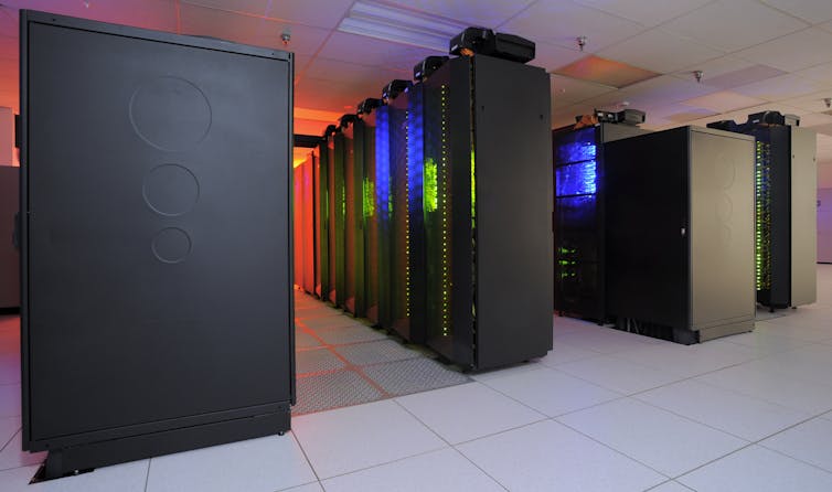 A climate-controlled room containing banks of computer processors