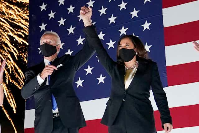 Joe Biden and Kamala Harris, wearing masks, and the DNC