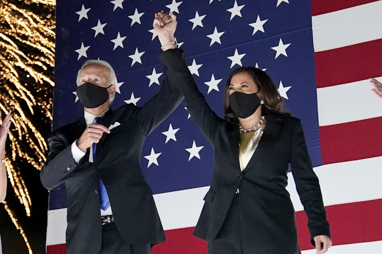 Joe Biden and Kamala Harris, wearing masks, and the DNC
