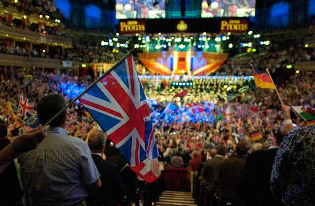The interior of the ALbert Hall for the Last Night of the Proms in 2014 with thousands of people waving the Union Flag.