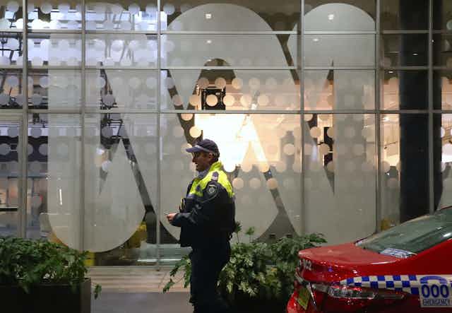 A policeman out the front of the ABC headquarters in Sydney