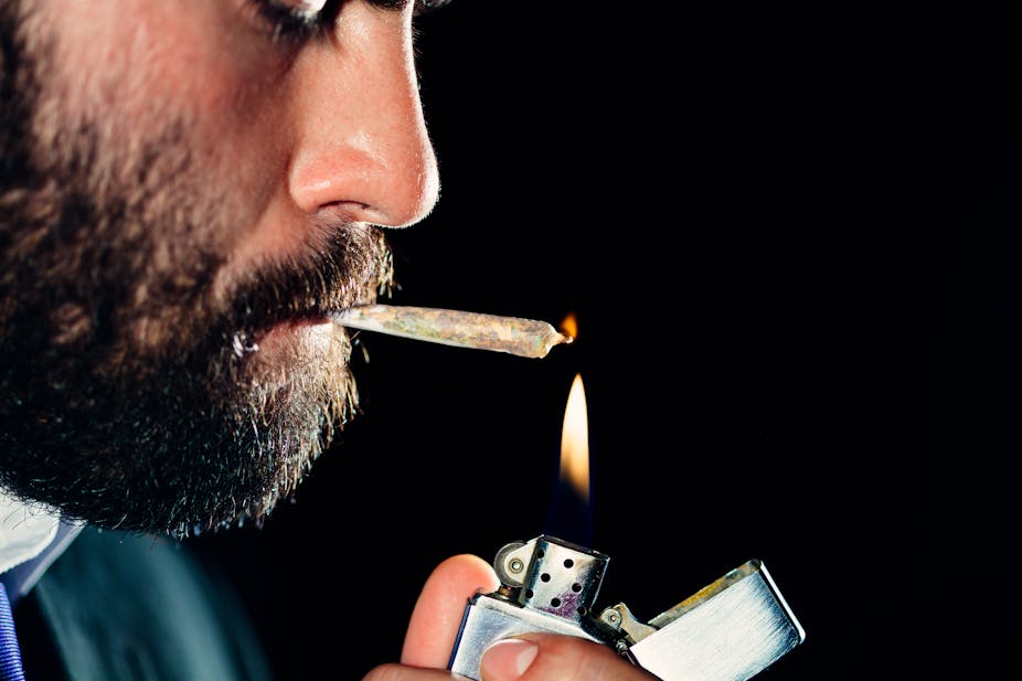 Man lighting up a joint.