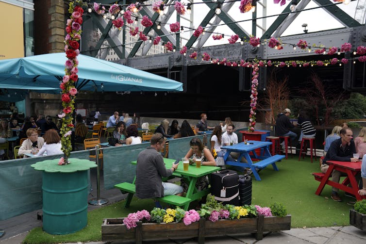 People dine at a restaurant in central London.