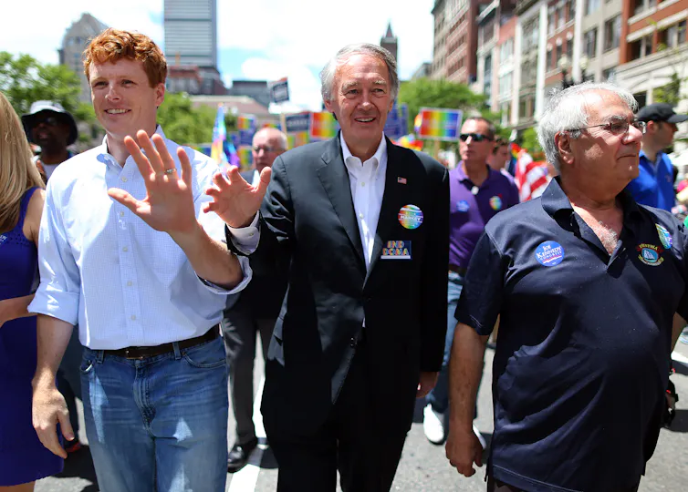 Joe Kennedy and Ed Markey march together in a parade in 2013.