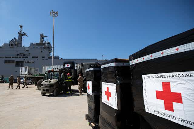 Black boxes on pallet from the French Red Cross.