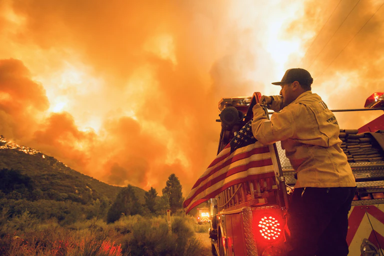 US firefighter watches blaze in California.