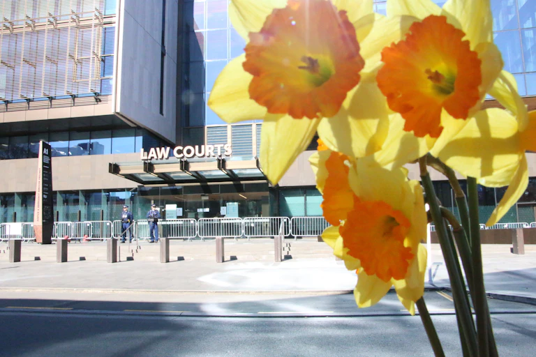 A bunch of flowers outside the office of the Law Courts