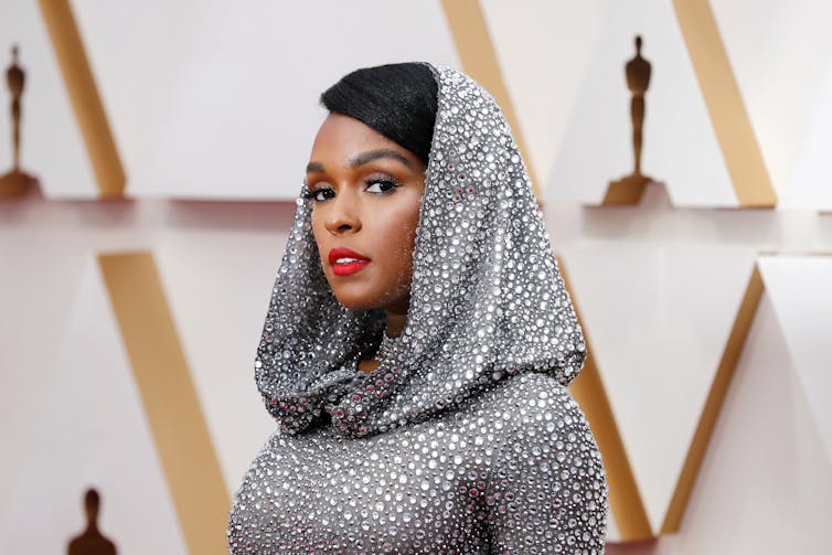 Glamorous woman in silver hood