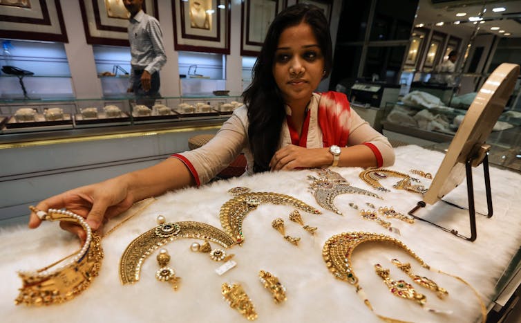 Woman shops for gold jewellery in Mumbai.