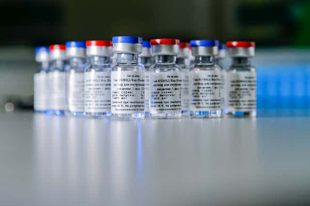 Containers with a two-vector COVID-19 vaccine