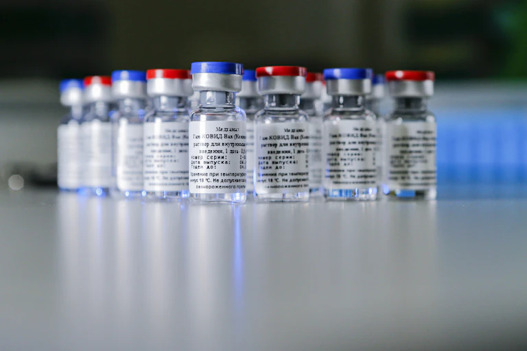 Containers with a two-vector COVID-19 vaccine