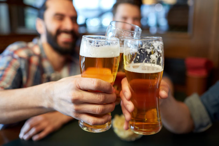 People drinking pints