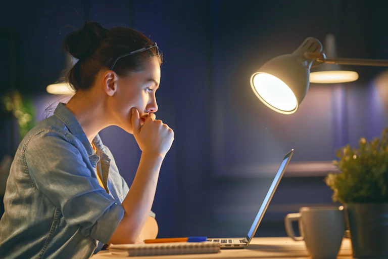 A woman works from home.