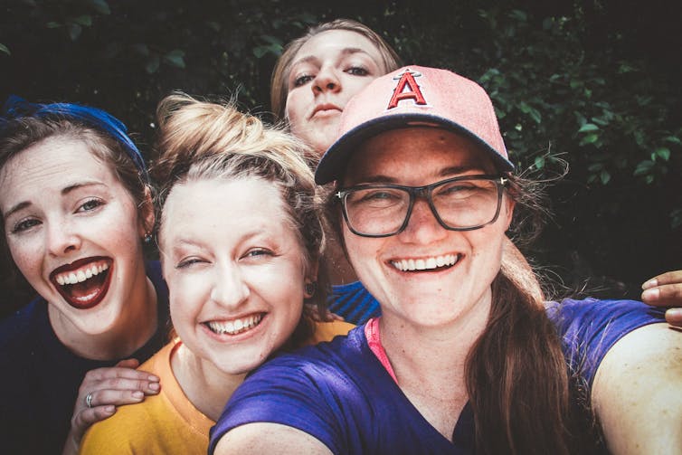 Group of girls posing for a selfie.